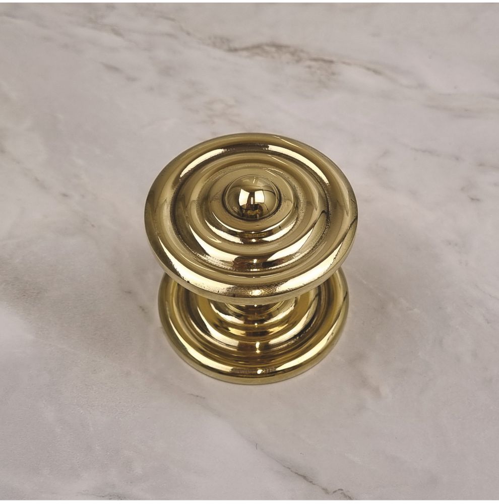 Bouton de porte avec rosace en laiton poli