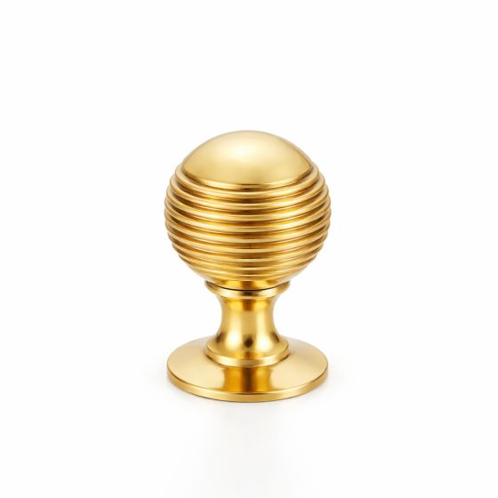 Bouton de placard sphérique à rainures sur platine en laiton poli