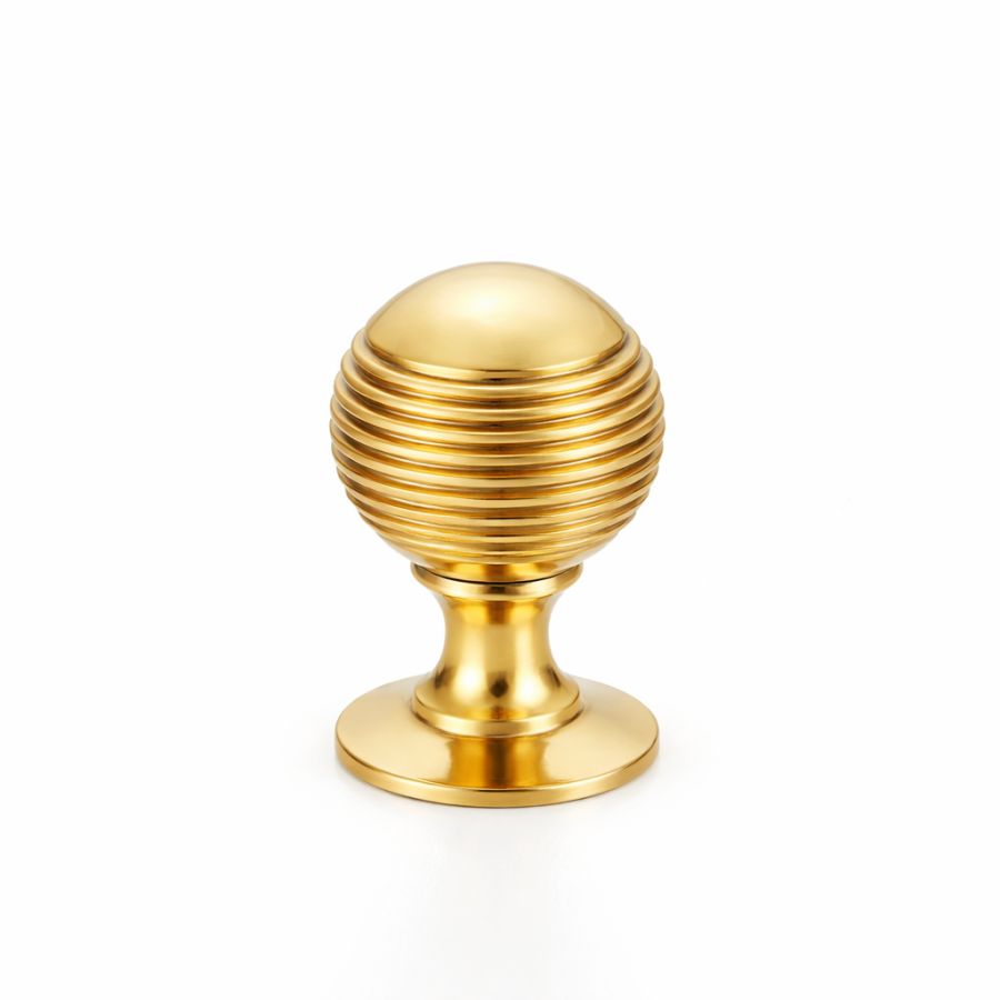 Bouton de placard sphérique à rainures sur platine en laiton poli