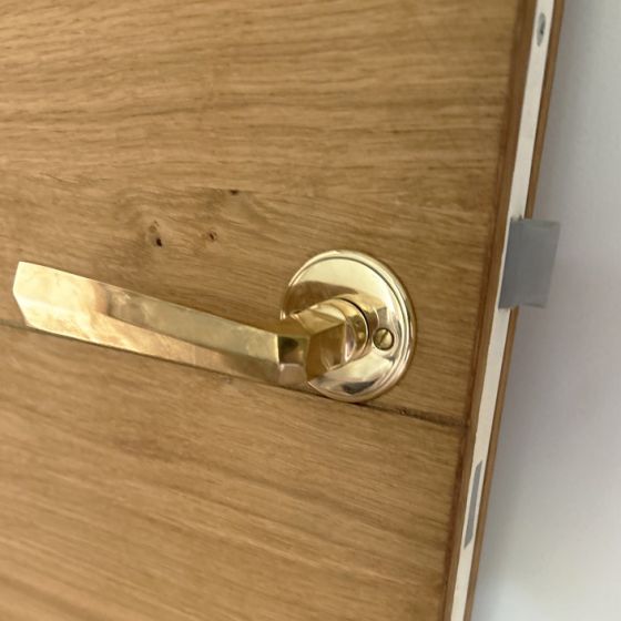 Poignée de porte à pans en laiton